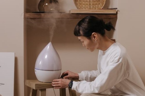 woman using humidifier